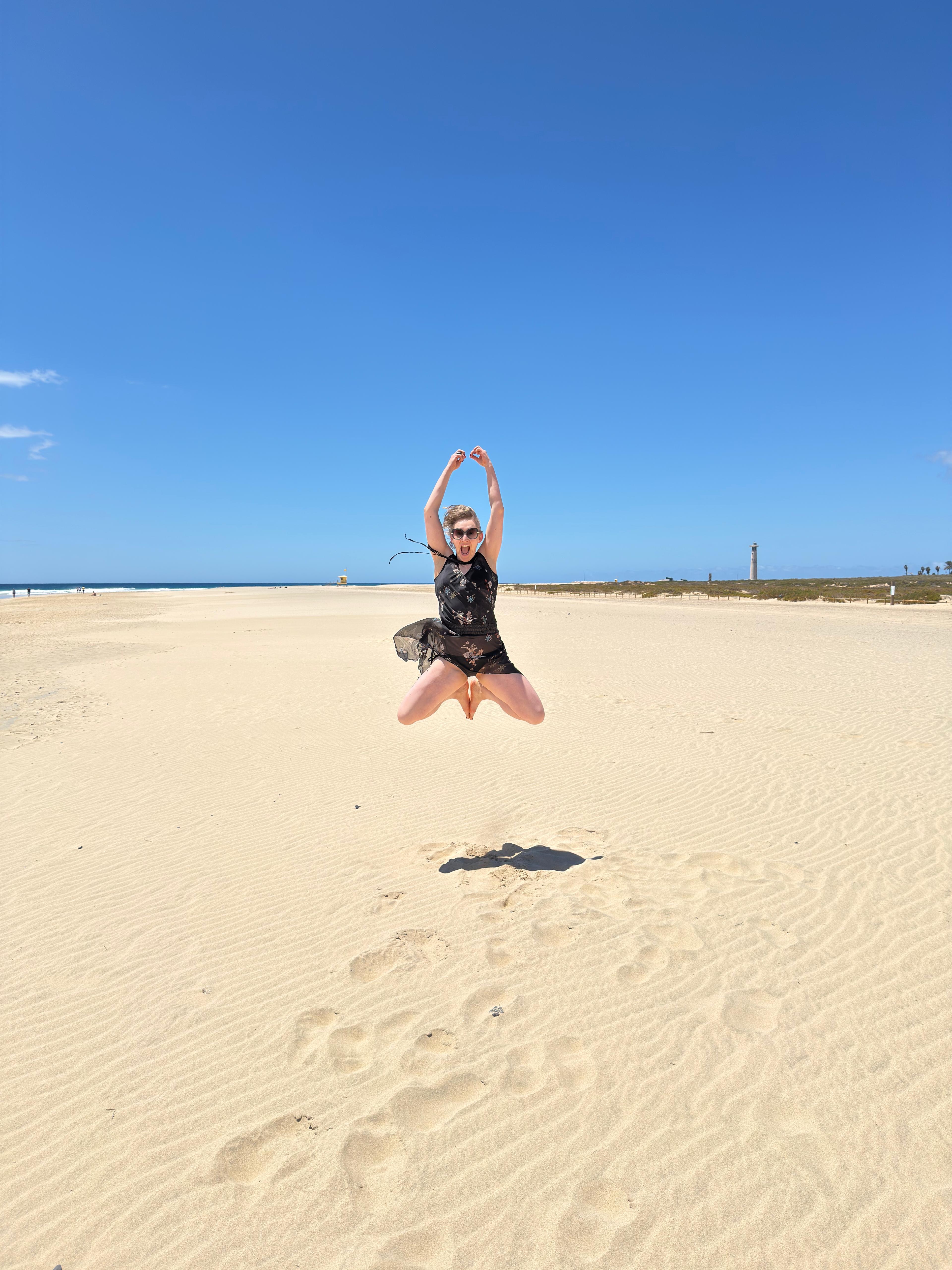 Annamarie jumping on the dunes
